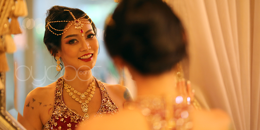 beautiful girl looking at the mirror and smiling